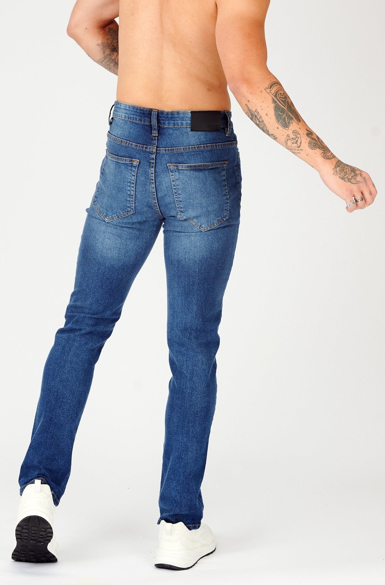 mens slim fit jeans mid blue back pocket detail