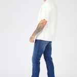 mid blue wash slim fit denim jeans close up detail