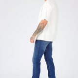 mid blue wash slim fit denim jeans close up detail