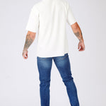 slim fit mid blue jeans side view full length leg