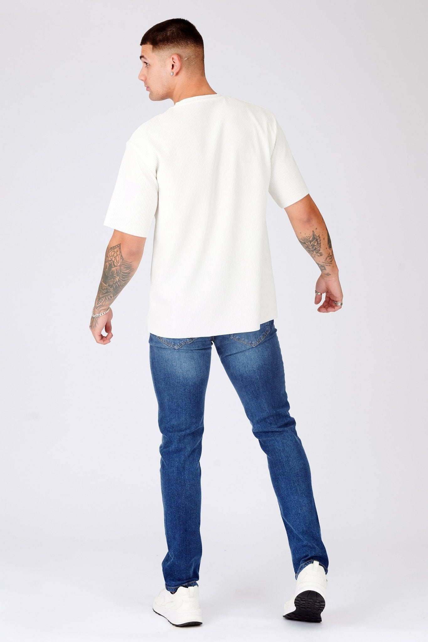 slim fit mid blue jeans side view full length leg