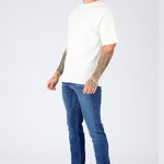 slim fit mid blue jeans button fly and waistband detail