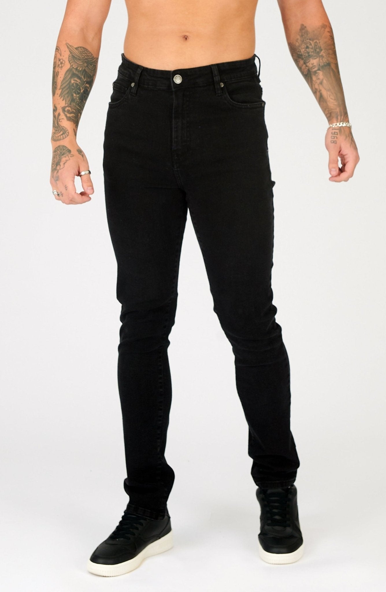 mens slim fit black jeans button fly and waistband close up