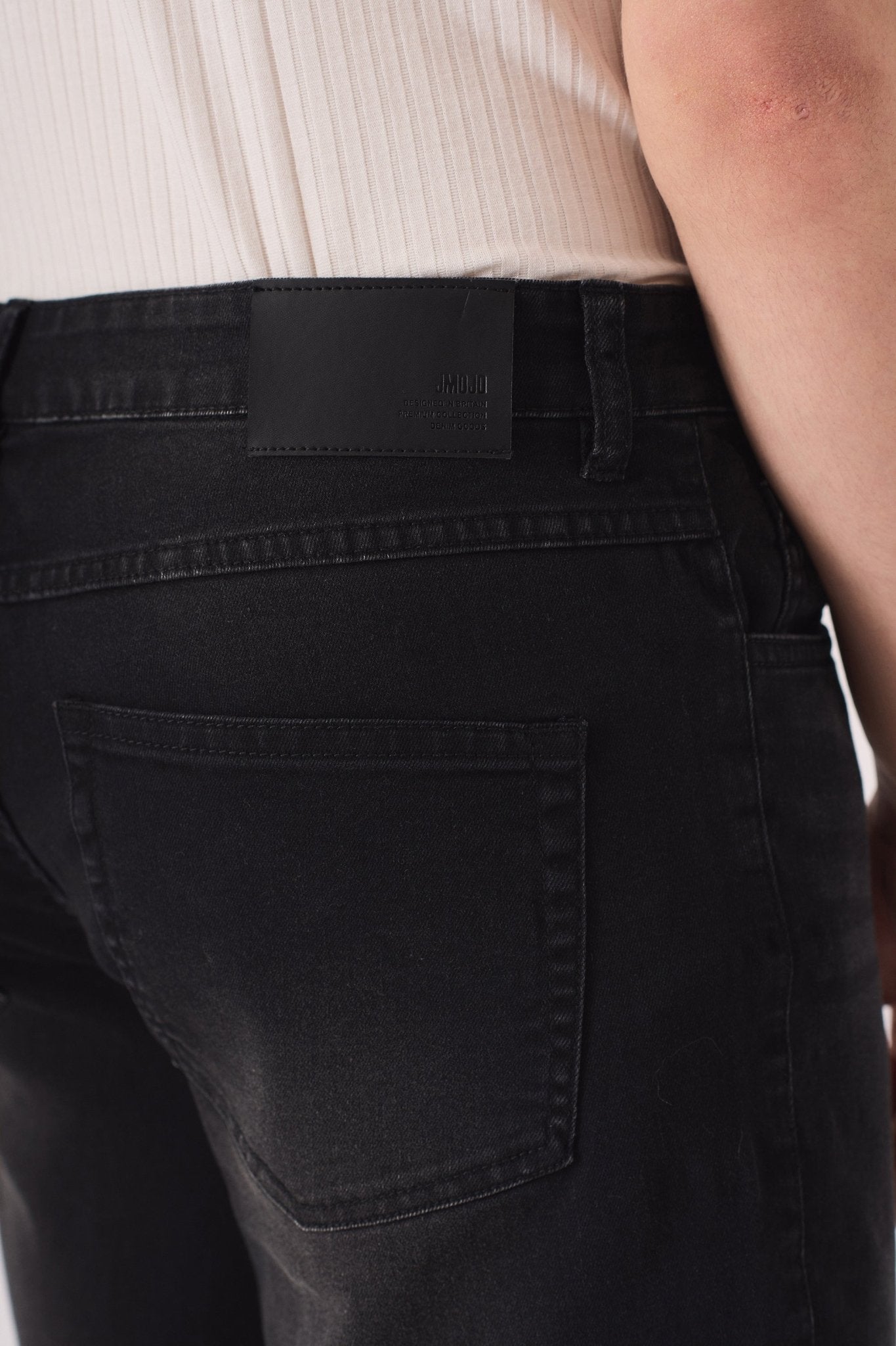 slim fit black wash jeans seated view stretch comfort
