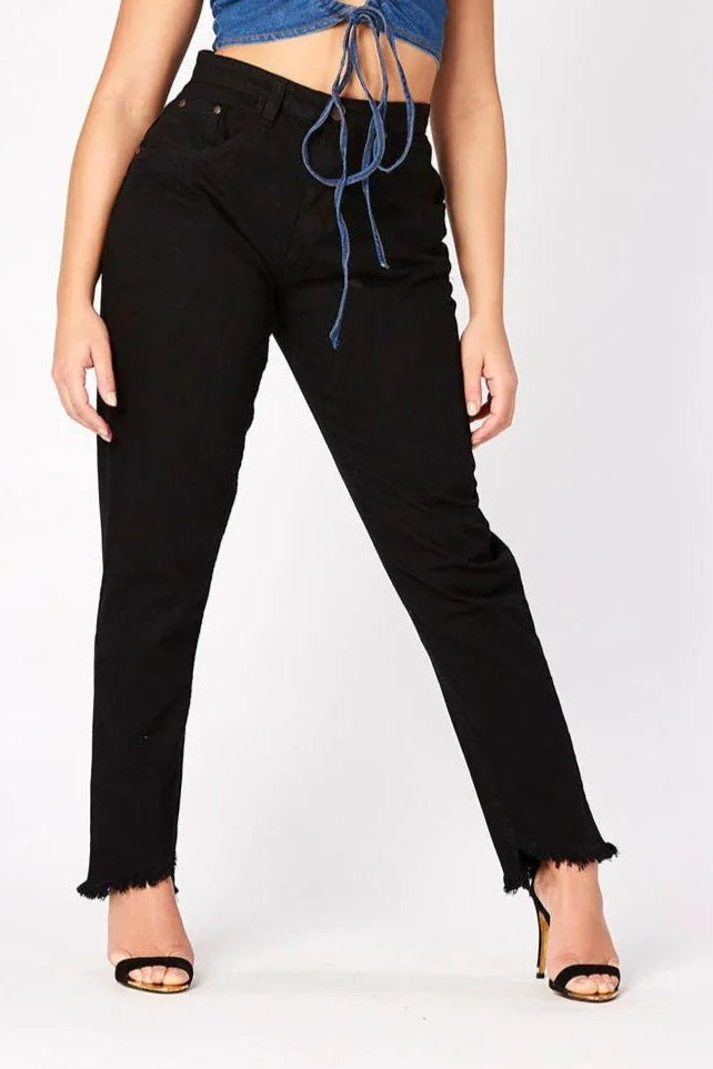 A model posing in womens high rise black frayed hem jeans featuring a stylish raw edge finish.